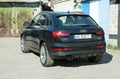 AUDI Q3 in black. Subcompact luxury crossover Audi Q3. Rear view, side view