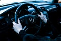 Car Mercedes-Benz R 350. Woman driving a car. Women`s hands hold the steering wheel