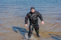 Professional diver near the river coastline. Commercial diving. Winter