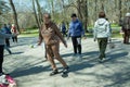 A group of seniors doing health and fitness gymnastics in the park. Old men do tennis ball