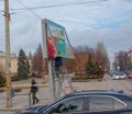 Installation of outdoor advertising in the city. Specialists climb the stairs to the billboard. Work at height