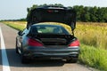Photos of Mercedes Benz SL550 convertible on the road. Details of the trunk of the car Royalty Free Stock Photo