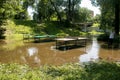 Public park drenched in rain. Water logged park.Wet benches. Park filled with water after