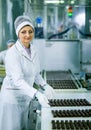 Dnepropetrovsk, Ukraine - 03.10.2016: Sweets factory. Sweets production process. A woman technologist monitors the work of an