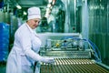 Dnepropetrovsk, Ukraine - 03.10.2016: Sweets factory. Sweets production process. A woman technologist monitors the work of an