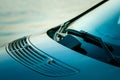 Windshield, wipers and part of the hood of the car Mercedes-Benz R 350. Close-up