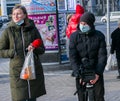 Young journalist and cameraman use a professional video camera to film news in the open air