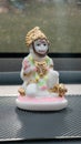 White ceramic figurine of Hanuman, the Hindu deity, adorned with golden embellishments Royalty Free Stock Photo