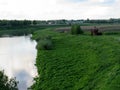 Dnieper, green coast and reconstruction of a wooden fortification Royalty Free Stock Photo