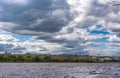 Dniepr River.City on the shore.Blue sky with scenic clouds.