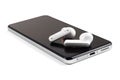 Dnipo, Ukraine, february 20, 2023: JBL Tune 230 NC TWS headphones. Closeup modern headphone on phone media portable