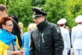 Dnipro, Dnepropetrovsk, Ukraine, May 12, 2018, a Ukrainian police officer talks to a woman at a holiday. Policeman in