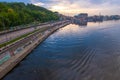 Dnipro river at sunset. Embankment of Dnieper river and Poshtova Square on Podil in historical district of Kyiv, Ukraine