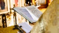 Christian priest reading church book, priest reads a pray over t Royalty Free Stock Photo