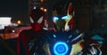 Two cosplayers stand together in images of a character Spider-Man and Iron Man at night