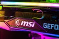 Dnipro, Ukraine - February 23, 2023: MSI Geforce RTX gaming graphics card in a open case with glow