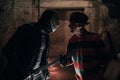 Cosplayers portray battle in image of Freddy Krueger and Jason Voorhees from Nightmare on Elm Street film