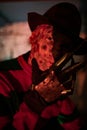 Portrait of cosplayer in image of Freddy Krueger from Nightmare on Elm Street film