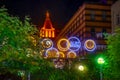 Glowing Alef Estate logo on Katerynoslavskyi Boulevard in Dnipro at night. Bright city