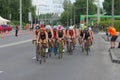 Group of female athletes on a bicycle section on a city street during of the 2019 Dnipro ETU Sprint Triathlon European Cup