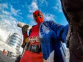 DNIPRO, UKRAINE - MARCH 28, 2019: Deadpool cosplayer posing against urban landscape and sky