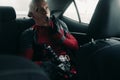 DNIPRO, UKRAINE - MARCH 28, 2019: Deadpool cosplayer posing in the car