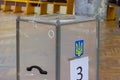 View of ballots in ballot box at vote station. Election of Ukraine President. Observers from different political parties