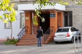 A man near the entrance to the office of the Department of Landscaping and Infrastructure of the Dniprovsky City Council Royalty Free Stock Photo