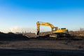 Dnipro, Ukraine - November 19, 2020: Yellow excavator hyundai on a construction site against blue sky