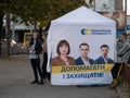 Dnipro, Ukraine - October 23, 2020: Agitators hand out leaflets at campaign cubes ahead of elections of local deputies. Lady with