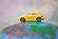 Dnipro, Ukraine - October 03, 2019: The car is located on the American continent of the world map. Concept of travel around world Royalty Free Stock Photo