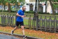 Lonely mature man running on an empty city street during 21 km distance of ATB Dnipro Marathon