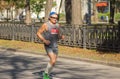 Lonely senior man running on an empty city street during 42 km distance of Almaz group Dnipro Marathon