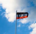 DNR flag on a background of blue sky. A disheveled flag