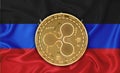 Dnr flag, ripple gold coin on flag background. The concept of blockchain, bitcoin, currency decentralization in the country. 3d-