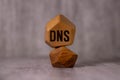 DNS - Acronym Domain Name System concept on cubes