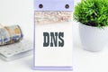 DNS. Domain Name System word writing on a desktop