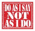 DO AS I SAY NOT AS I DO, text written on red stamp sign Royalty Free Stock Photo