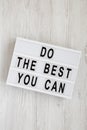 `Do the best you can` words on a modern board on a white wooden background, top view. Overhead, from above, flat lay. Close-up Royalty Free Stock Photo