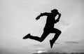 Do or Die. personal achievement goal. man silhouette jump on sky background. confident businessman running. daily Royalty Free Stock Photo