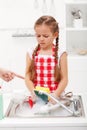 Do the dishes this instant - child ordered to wash up tableware Royalty Free Stock Photo