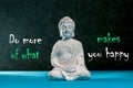 Do more of what makes you happy Background with white statuette of Buddha. Yoga and meditation concept
