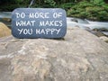 Do More Of What Makes You Happy. Inspirational motivation quote. With nature background. Royalty Free Stock Photo