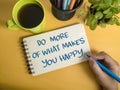 Do more of what makes you happy, text words typography written on book against yellow background, life and business motivational Royalty Free Stock Photo