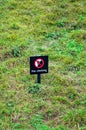 Do not climb sign board in the grass and on the slope Royalty Free Stock Photo