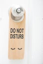 Do not disturb sign hanging on the door Royalty Free Stock Photo