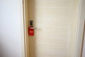 Do not disturb sign on the hotel room door. The concept of a comfortable stay in a hotel Royalty Free Stock Photo