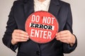 Do Not Enter Error Concept with Business Person Holding Red Warning Sign Royalty Free Stock Photo