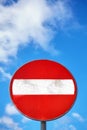 Do not enter round sign against blue cloudy sky. Royalty Free Stock Photo