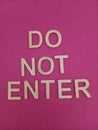 Do not enter sign on a pink background